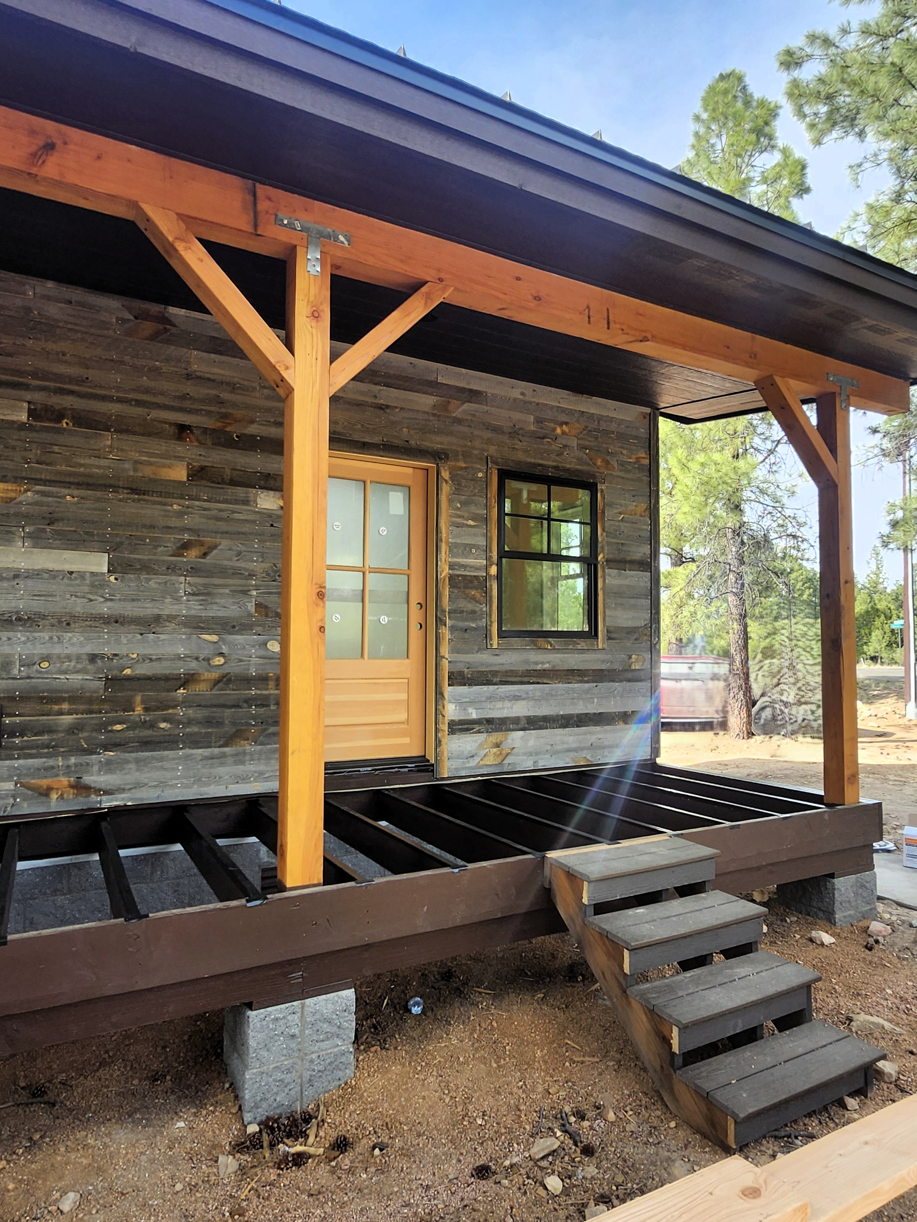 Close-up of exterior siding and timber frame posts