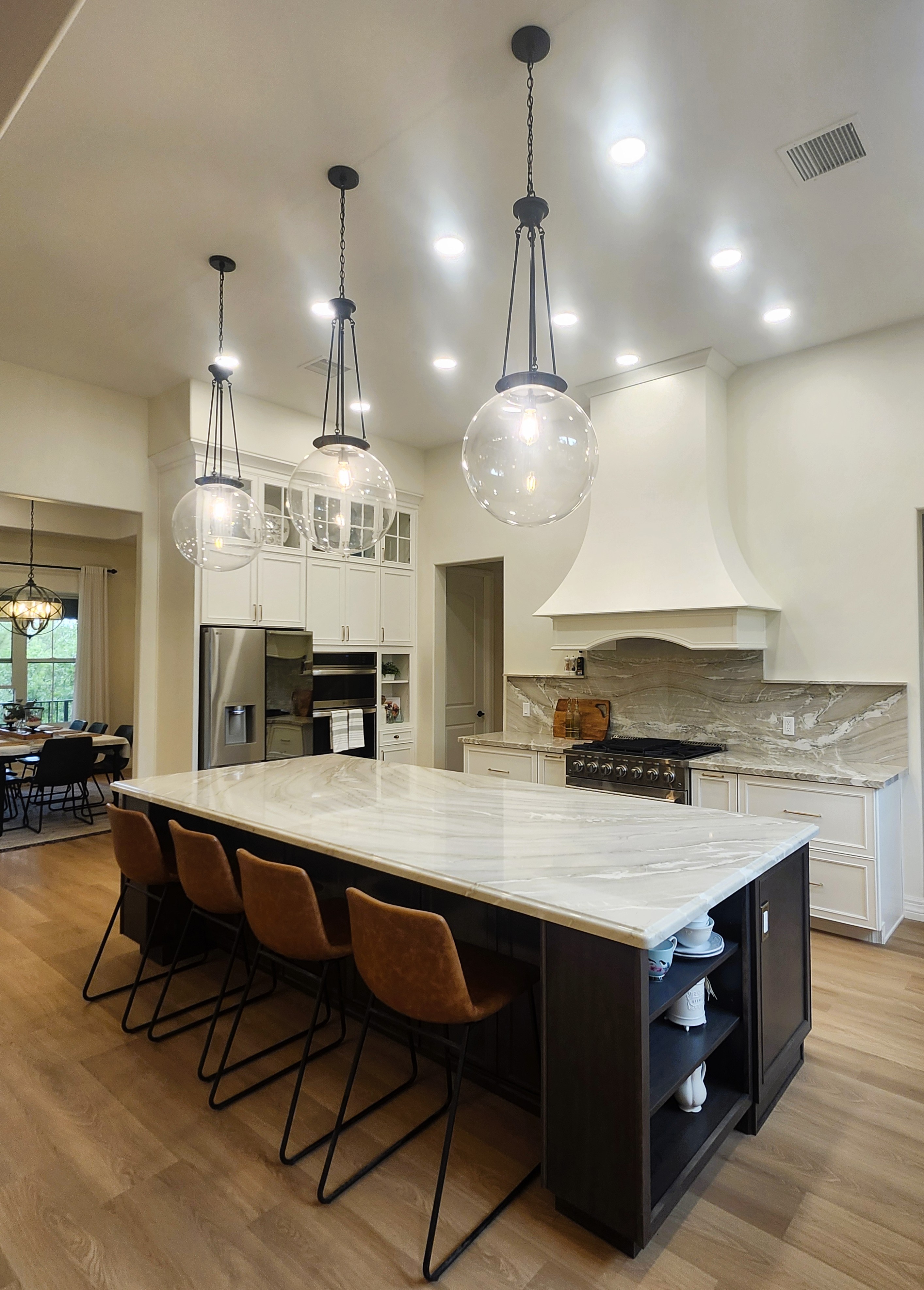 Island view with stove and fridge wall